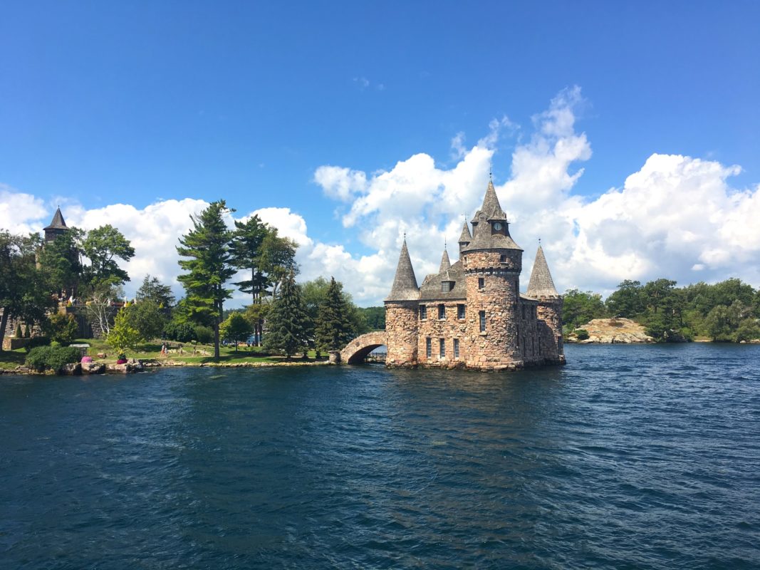 stone castle structure at the edge of a lake | fall in ontario