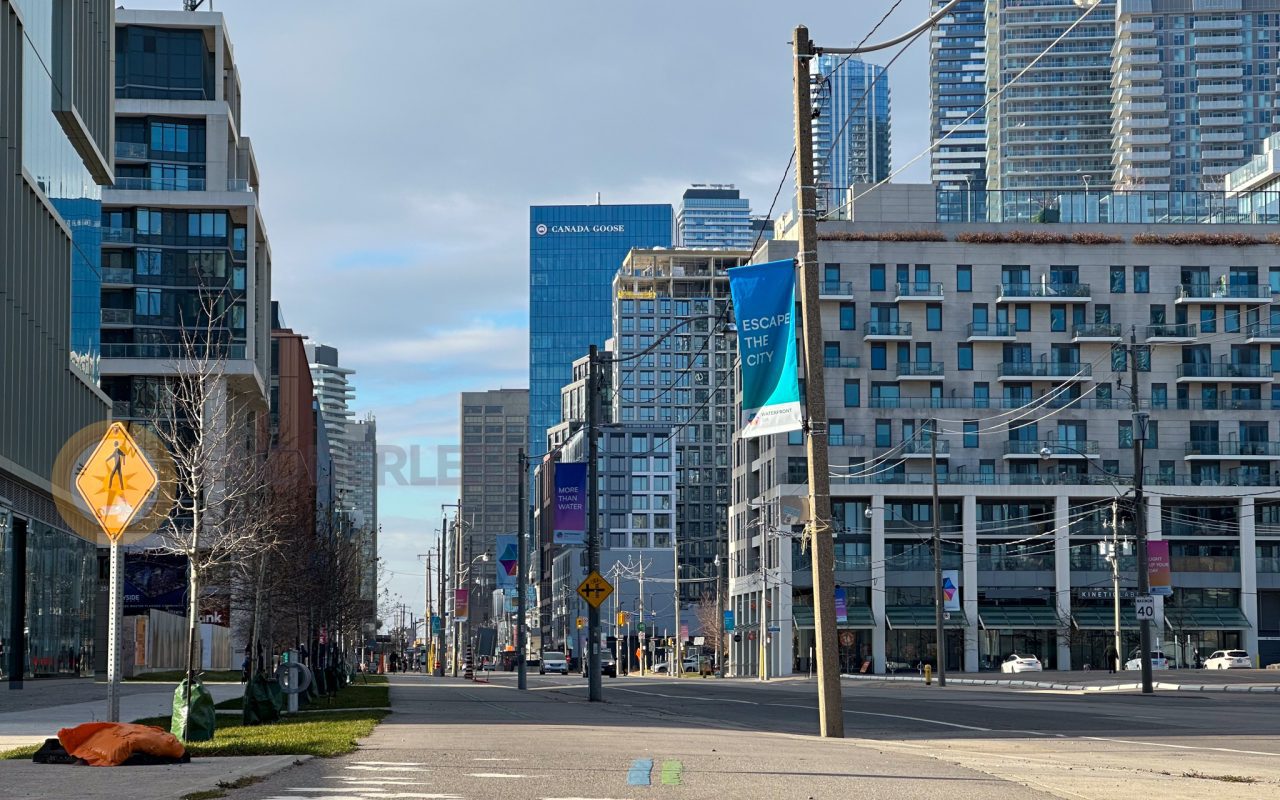 a street with buildings in the background - best trails in toronto