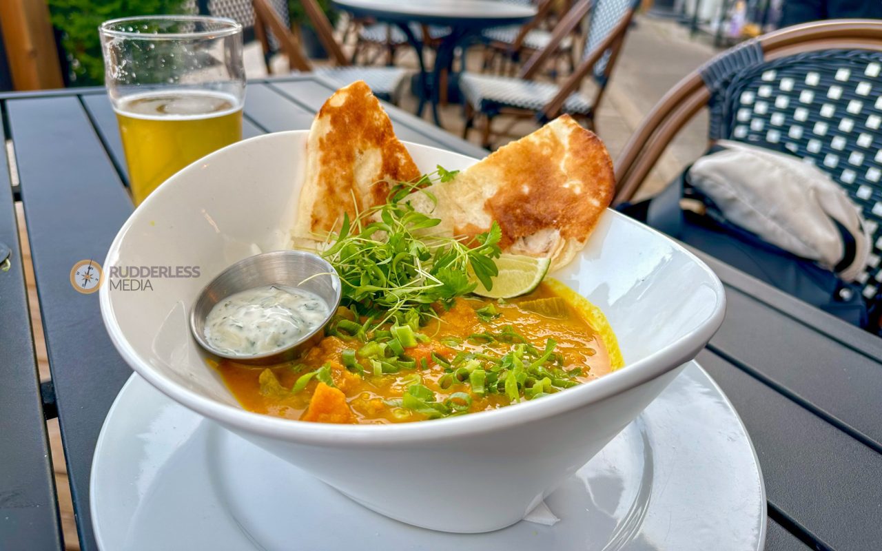 elora gorge - a bowl of soup with a sauce and a glass of beer