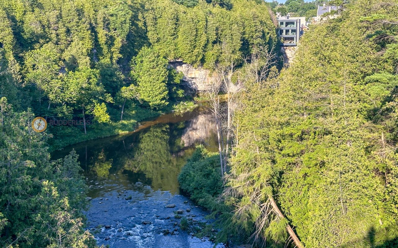 elora gorge - a river with trees around it