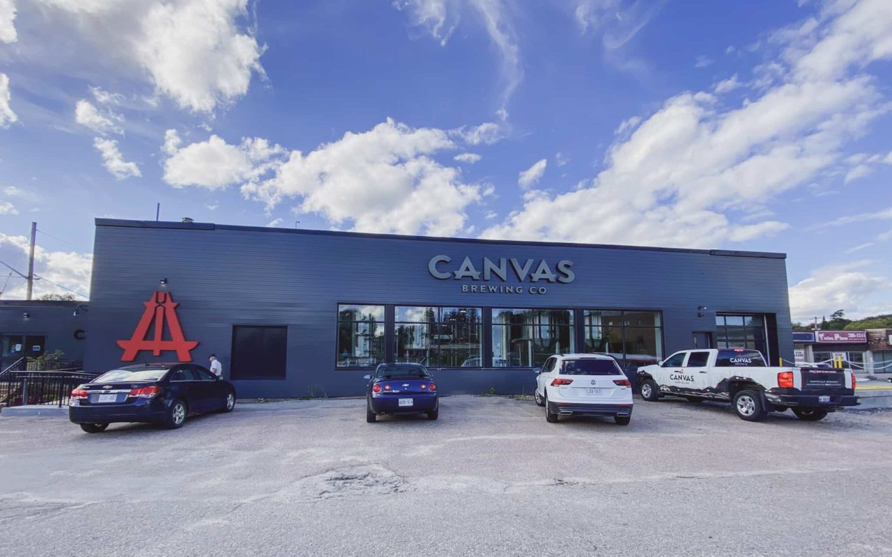 view of the front of Canvas Brewing Co in Huntsville, Ontario