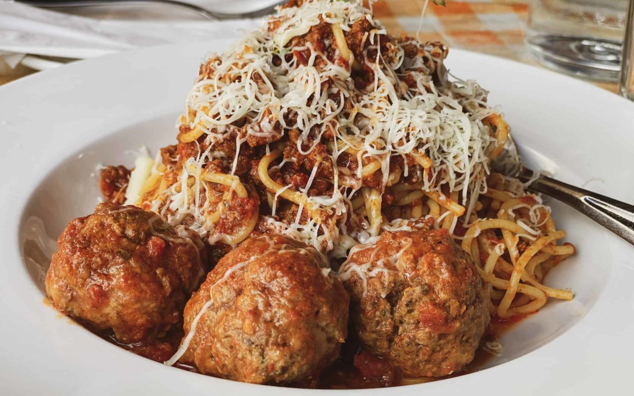close-up view of a plate of spaghetti and meatballs