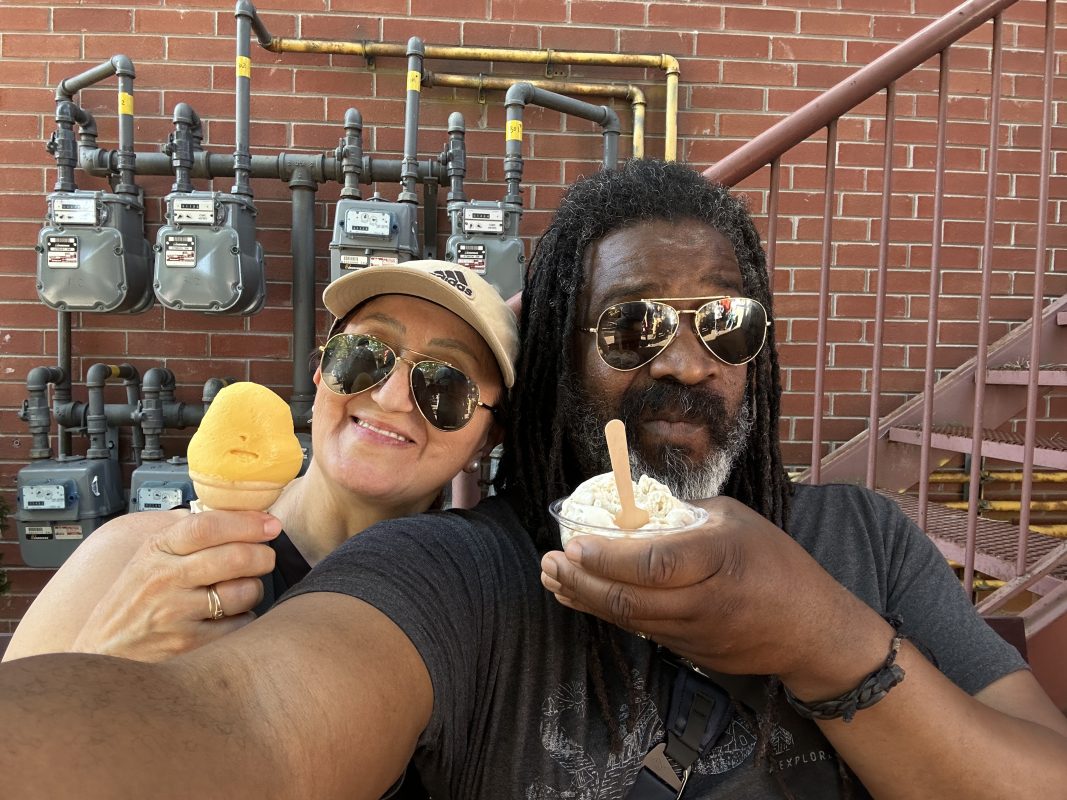 a man and woman holding ice cream