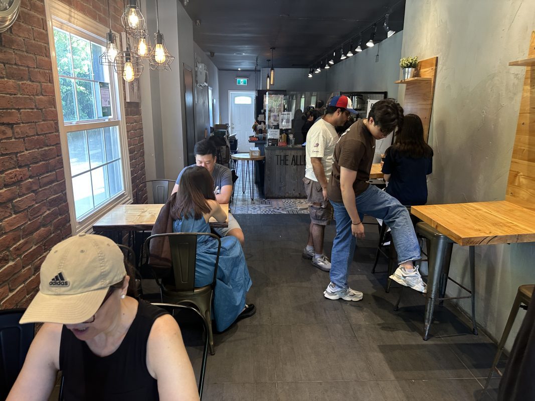 a group of people sitting at tables in a room