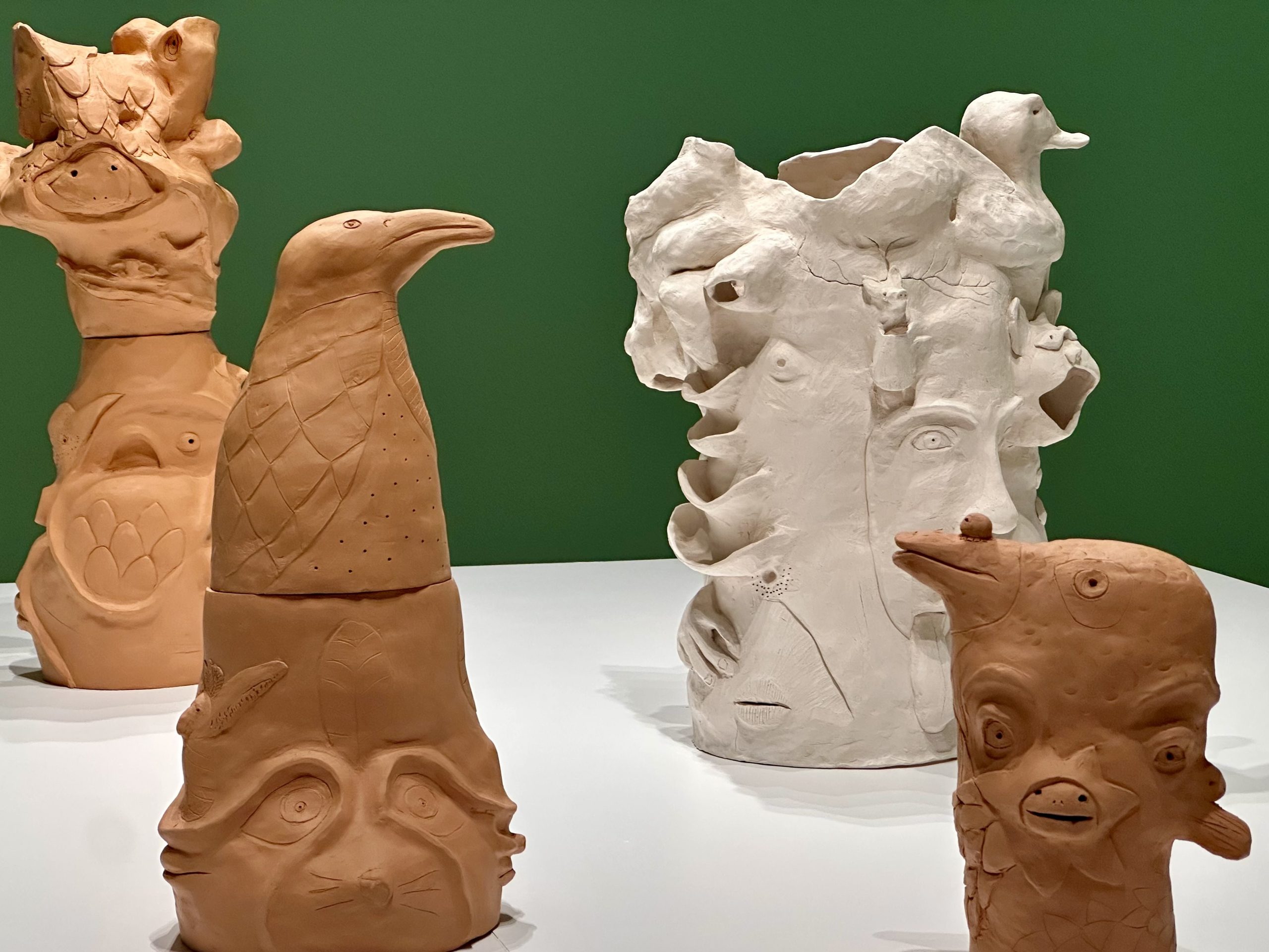 a group of clay sculptures on a table