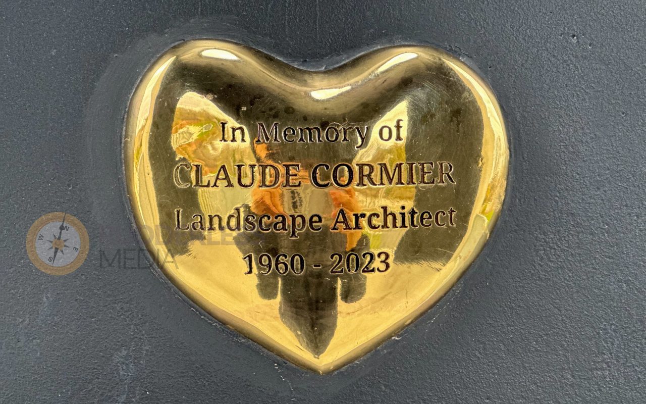 a gold heart with text on it - martin goodman