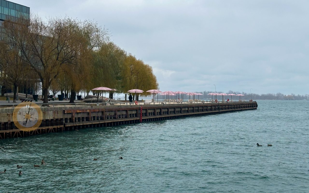 a dock with umbrellas on the side - martin goodman trail