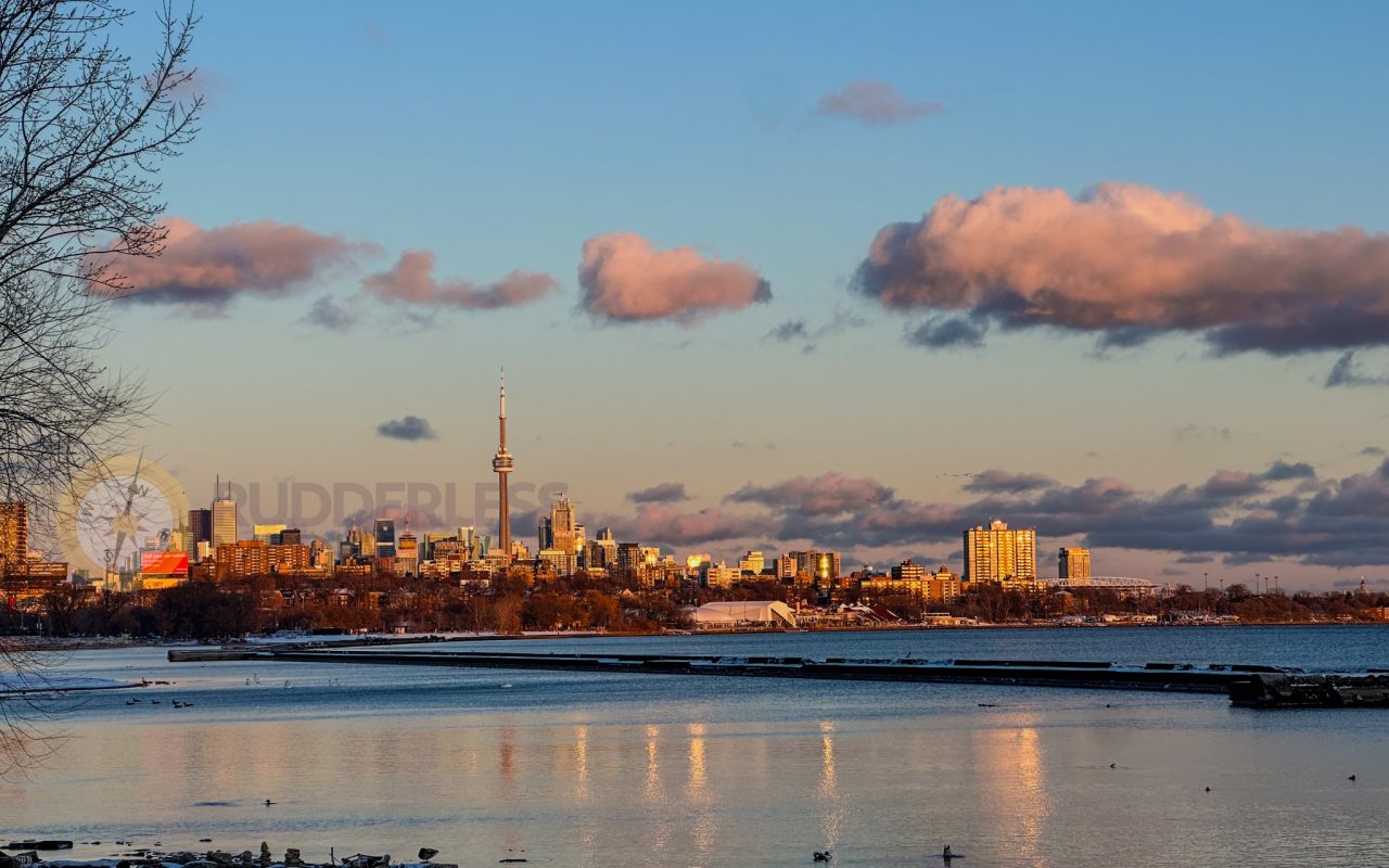 a city skyline with a body of water