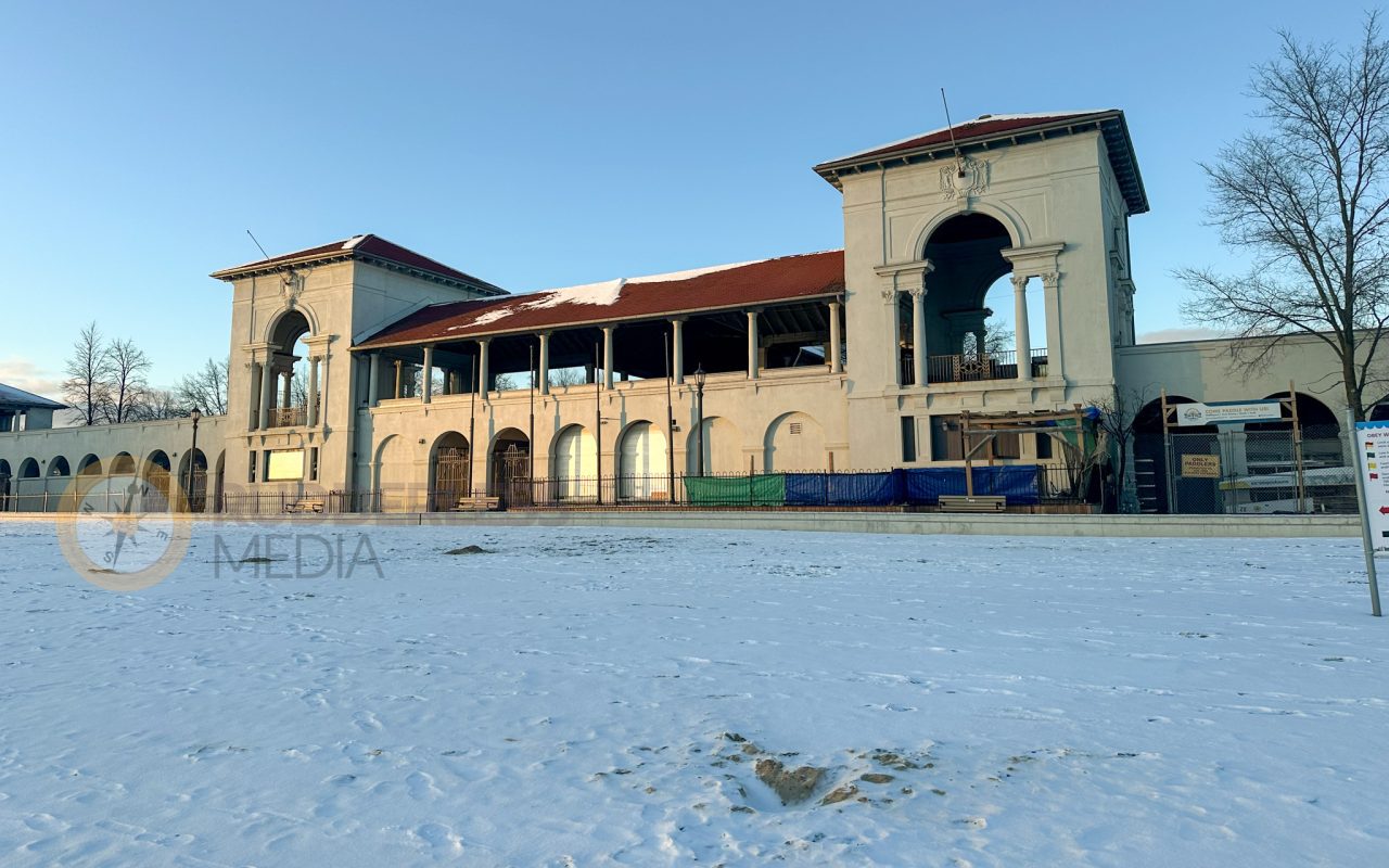 a building with a snowy field