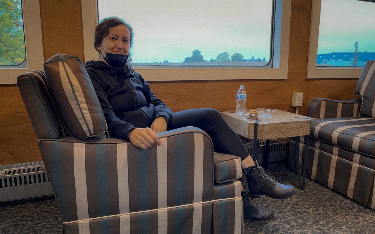 Woman sitting in a chair aboard a train | st jacobs downtown