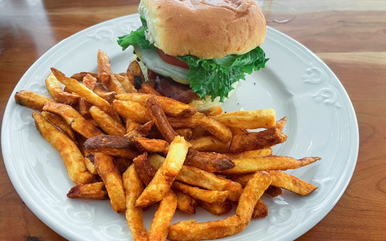 Burger and fries on a white place | st. jacobs
