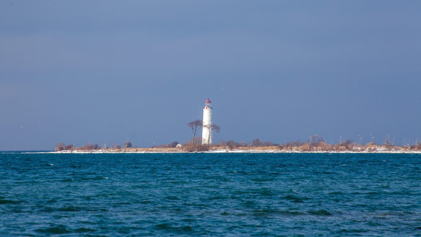 open water with a lighthouse in the distance | things to do in collingwood this weekend
