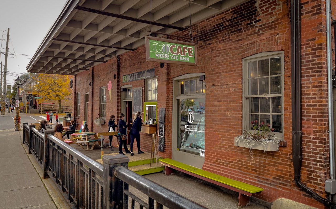 People enjoying coffee at the Eco Cafe, an outdoor cafe patio | things to do in saint jacobs
