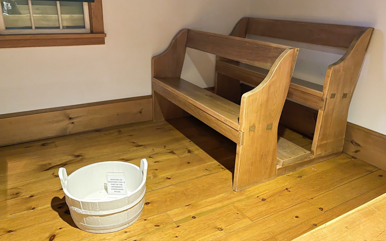 Wooden benches inside a Mennonite museum | things to do in st jacobs ontario