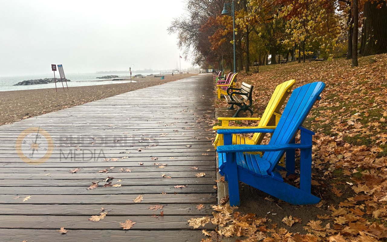 a boardwalk with benches on it - toronto lakefront