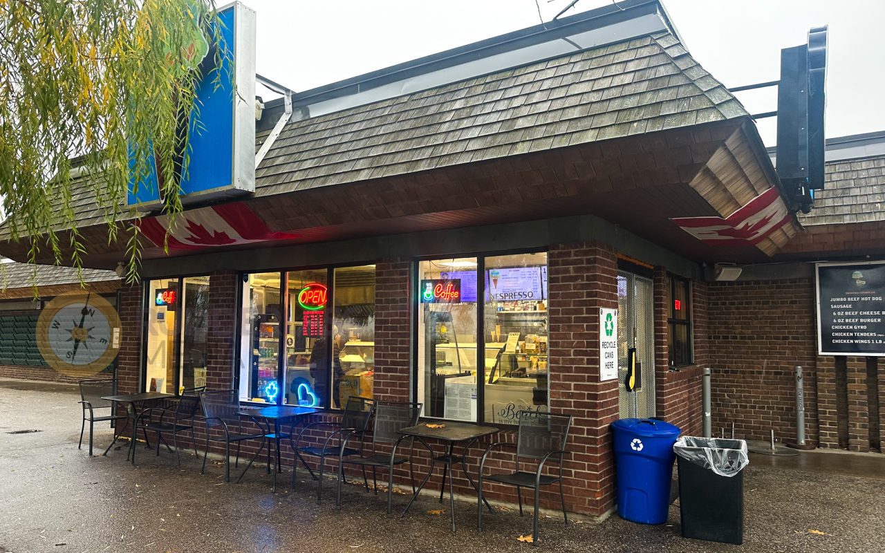 a restaurant with tables and chairs outside - toronto waterfront trail