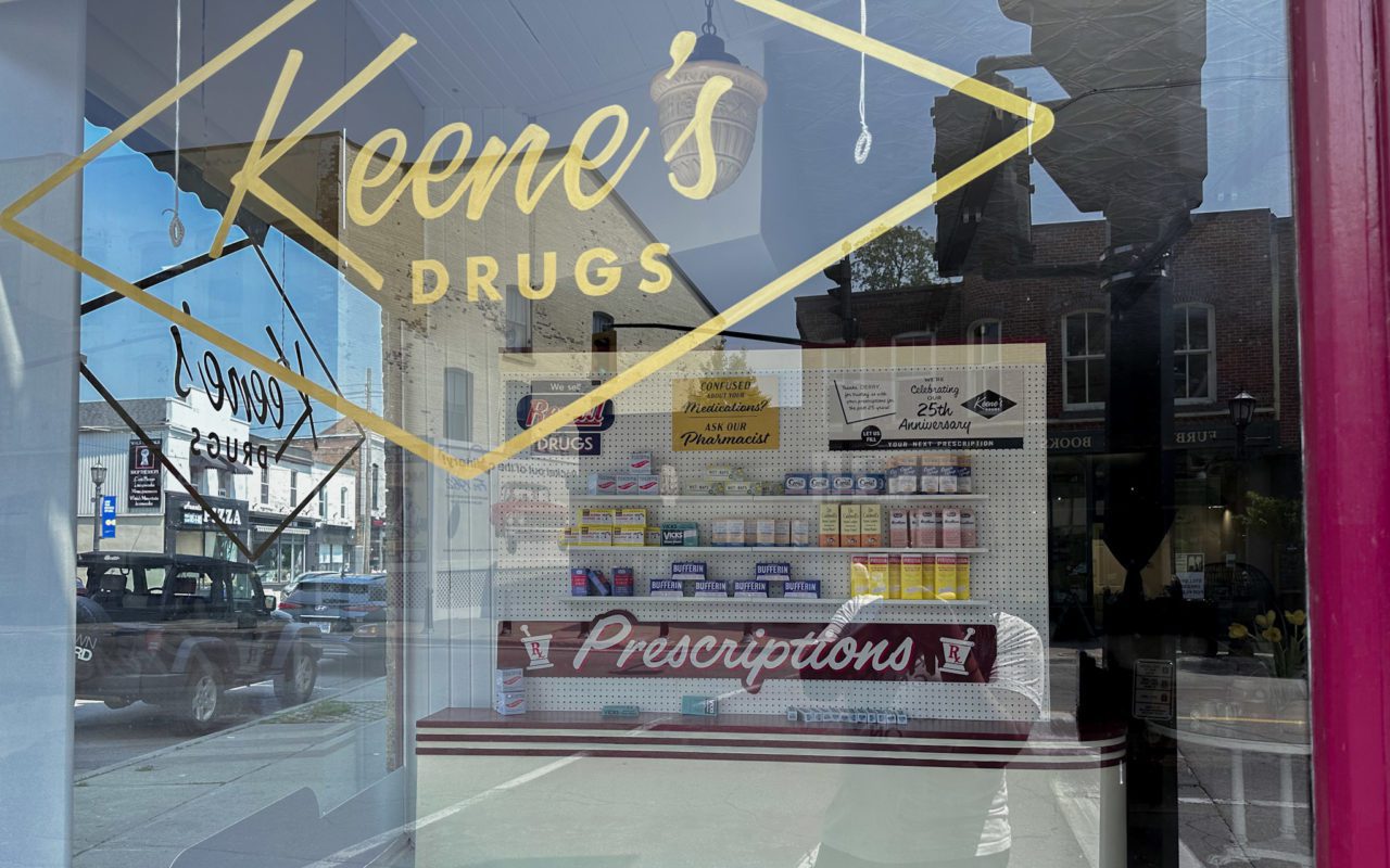 view looking through the window of Keene's Drugs in Port Hope