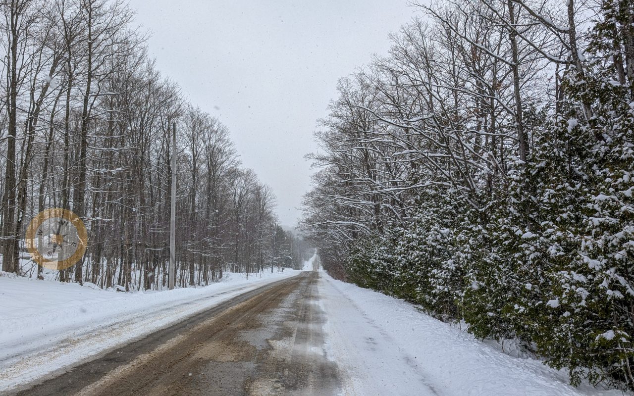 a road with snow on it - winter road trip
