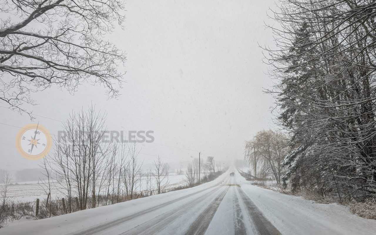 a road with snow on it - winter weather safety